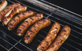 Stock Image: Grilling sausages on barbecue grill