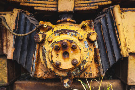 Stock Image: grunge yellow metal tram wheels
