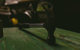 Stock Image: hammer on wood