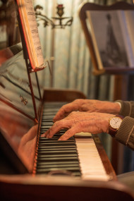 Stock Image: Hands on the piano vintage style