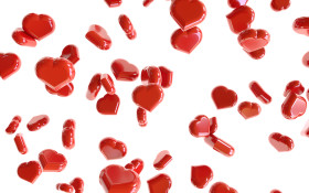Stock Image: Heap of red hearts on white background falling down