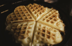 Stock Image: heart shaped waffles in iron waffle pan