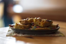 Stock Image: Homemade cake with chocolate lentils on a plate