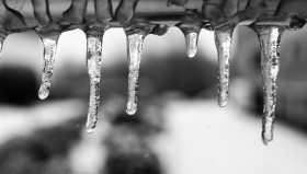 Stock Image: Icicles on an iron bar