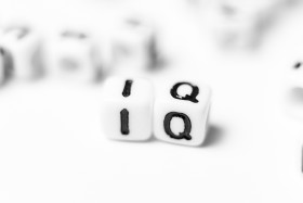Stock Image: IQ - intelligence quotient - bright dice font concept