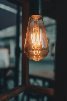 Stock Image: Light bulb on a terrace in rainy mood