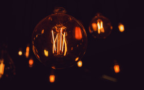 Stock Image: Light Bulbs on black background