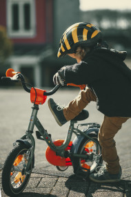 Stock Image: Little boy climbs on a bicycle