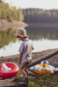Stock Image: little boy on the beach of a lake