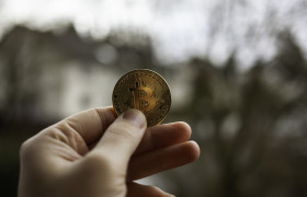 Stock Image: Male hand holding Bitcoin