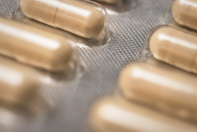 Stock Image: medicine capsules beige