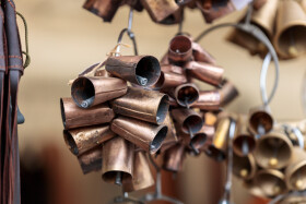 Stock Image: Melodic Tradition: Bells for Sheep and Animals at the Market