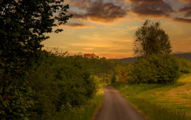 Stock Image: Melsungen by Kassel in Hesse, Germany - Rural Landscape with a castle on a hill