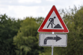 Stock Image: Men at work sign