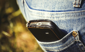 Stock Image: mobile phone in back pocket