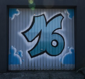 Stock Image: Number 16 graffiti on a garage door