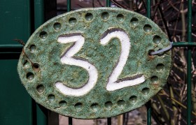 Stock Image: number 32 on a fence