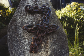 Stock Image: number 7 in chains on a stone