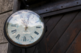 Stock Image: old clock on house wall