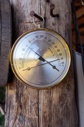 Stock Image: Old round thermometer with humidity indicator