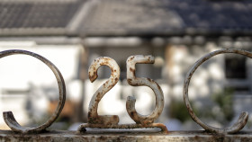 Stock Image: old rusty door with 25 sign