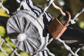 Stock Image: old rusty love padlock with heart
