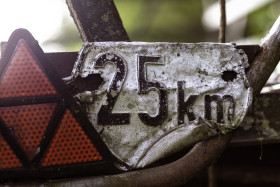 Stock Image: old rusty Speed Limit 25 km Sign