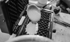 Stock Image: old waffle iron preparing