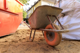 Stock Image: Old wheelbarrow on a construction site