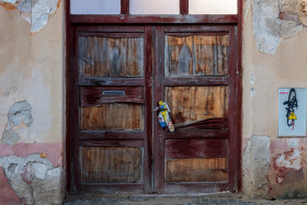 Stock Image: Old wooden gate of an abandoned building