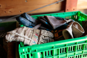 Stock Image: Old work gloves in a box