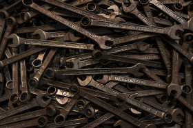 Stock Image: old wrench background