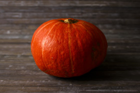 Stock Image: Orange Pumpkin on wooden background