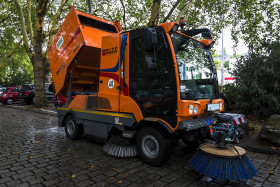 Stock Image: orange street cleaning truck