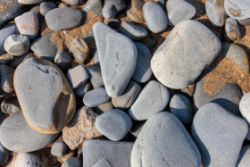Stock Image: Pebbles by the sea polished by the water