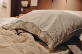 Stock Image: Pillow on a bed in the bedroom