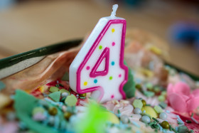 Stock Image: Pink Candle for the Fourth Birthday