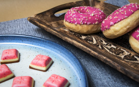 Stock Image: pink donuts and strawberry chocolate pralines