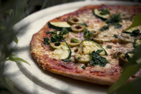Stock Image: pizza with zucchini spinach olives