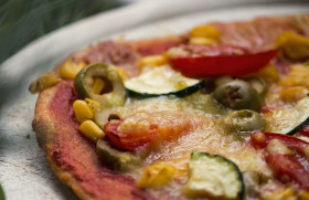 Stock Image: pizza with zucchini spinach olives corn tomatoes