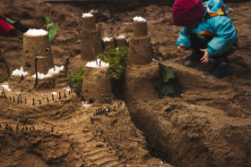 Stock Image: playing with sand building a castle