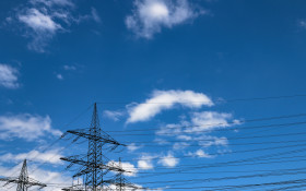 Stock Image: power poles under blue sky