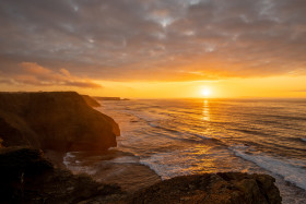 Stock Image: Praia de monte Clerigo Sunset over the Atlantic Ocean Landscape