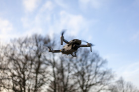 Stock Image: Quadrocopter drone flying in the sky