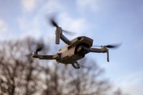 Stock Image: Quadrocopter drone flying in the sky