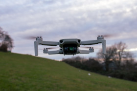 Stock Image: Quadrocopter drone flying in the sky