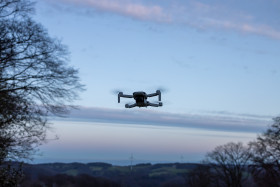 Stock Image: Quadrocopter drone flying in the sky