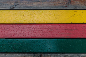 Stock Image: Rain wet motley wooden wall texture