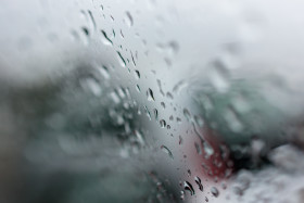 Stock Image: Raindrops on a car window background