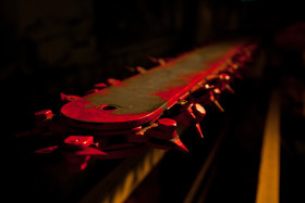 Stock Image: red chainsaw blade